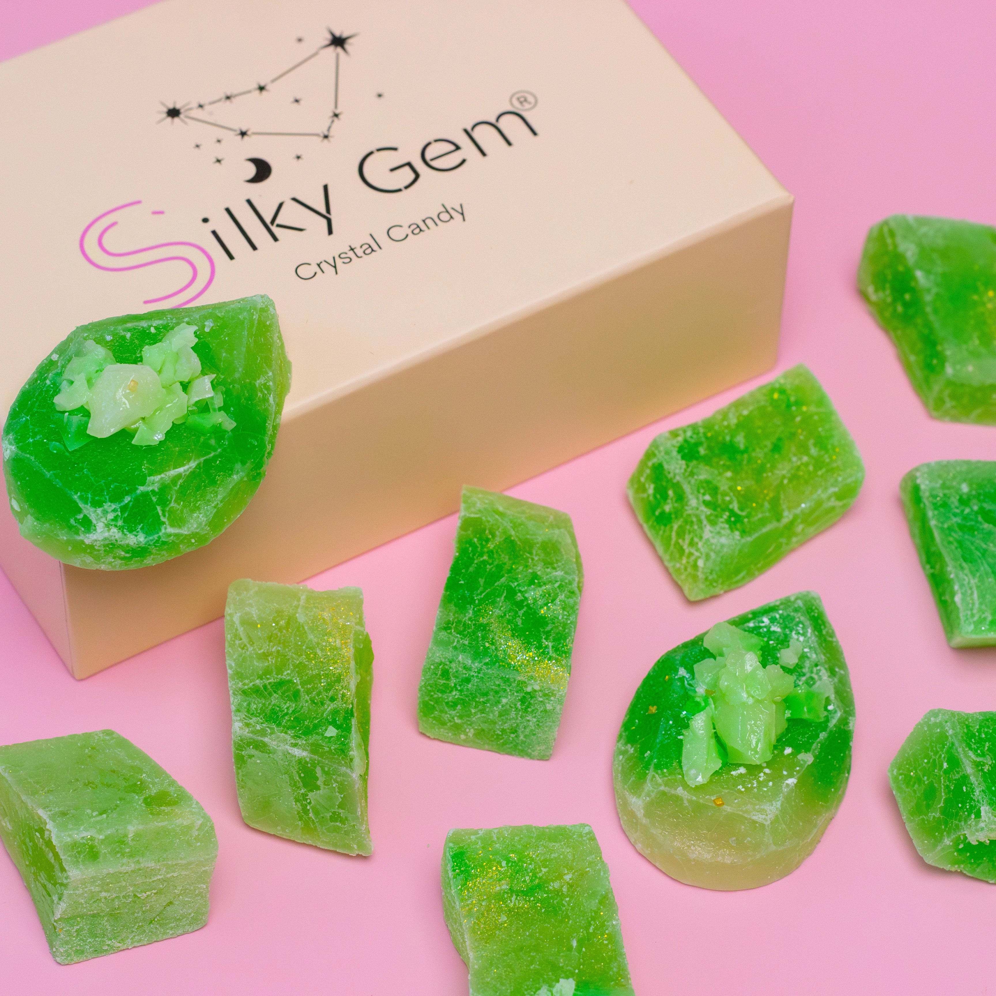 Silky Gem crystal candy on a pink background with a box labeled 'Silky Gem'.