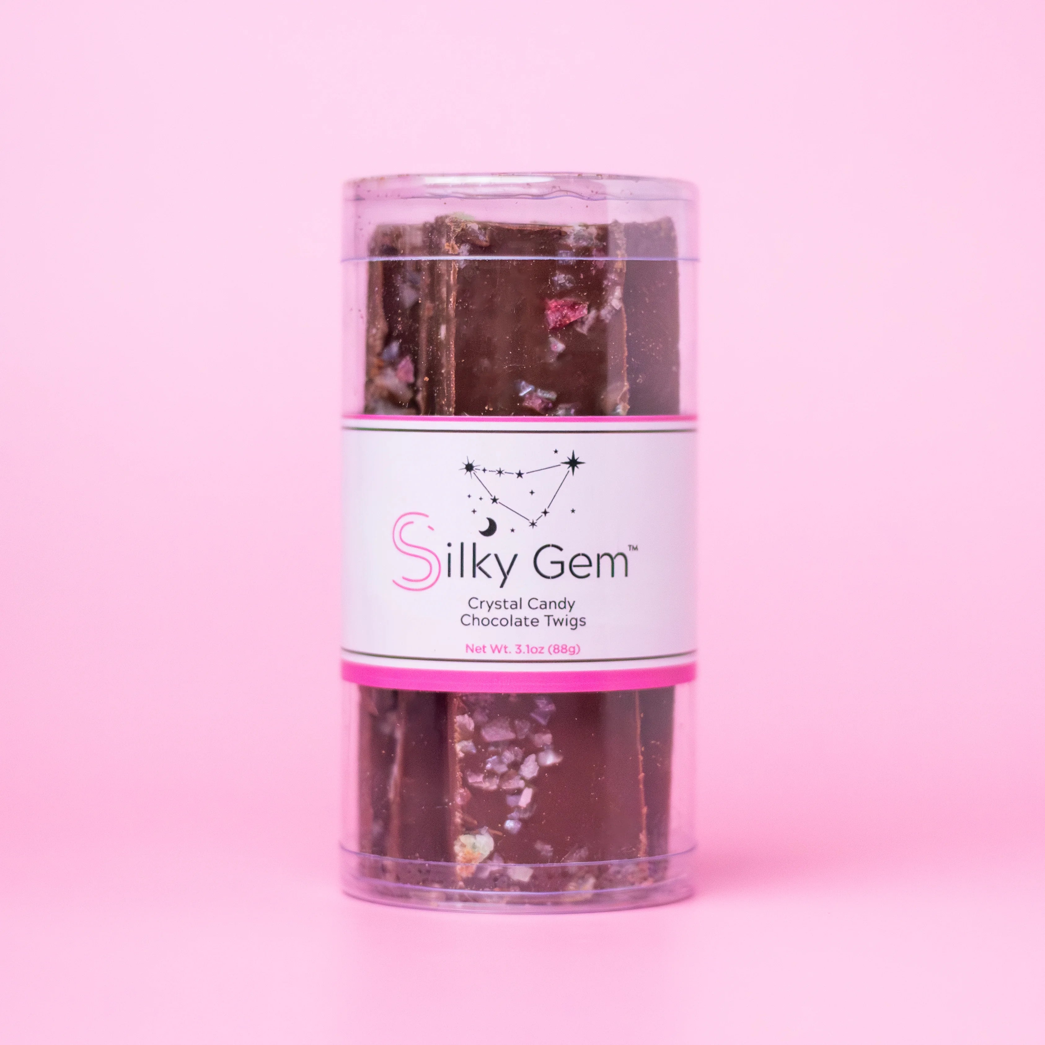Silky Gem chocolate twigs packaging on a pink background