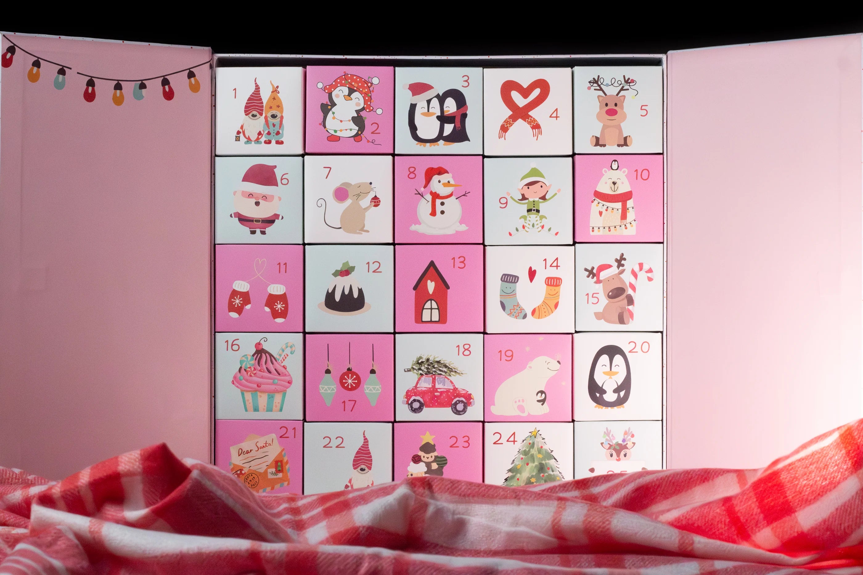 Unfolded pink advent calendar with cartoon characters on a pink background