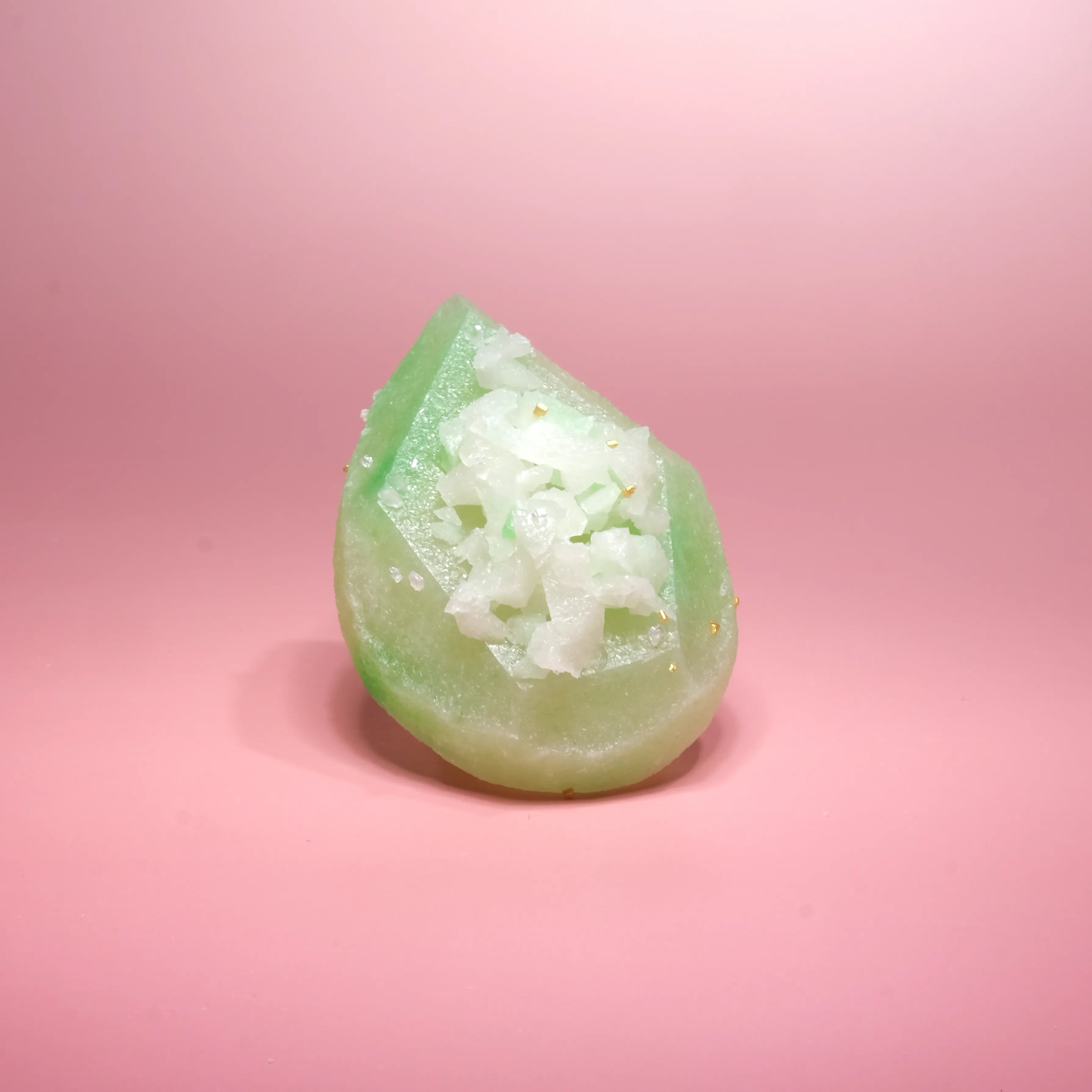 jade green teardrop-shaped crystal candy topped with sparkling crystals.