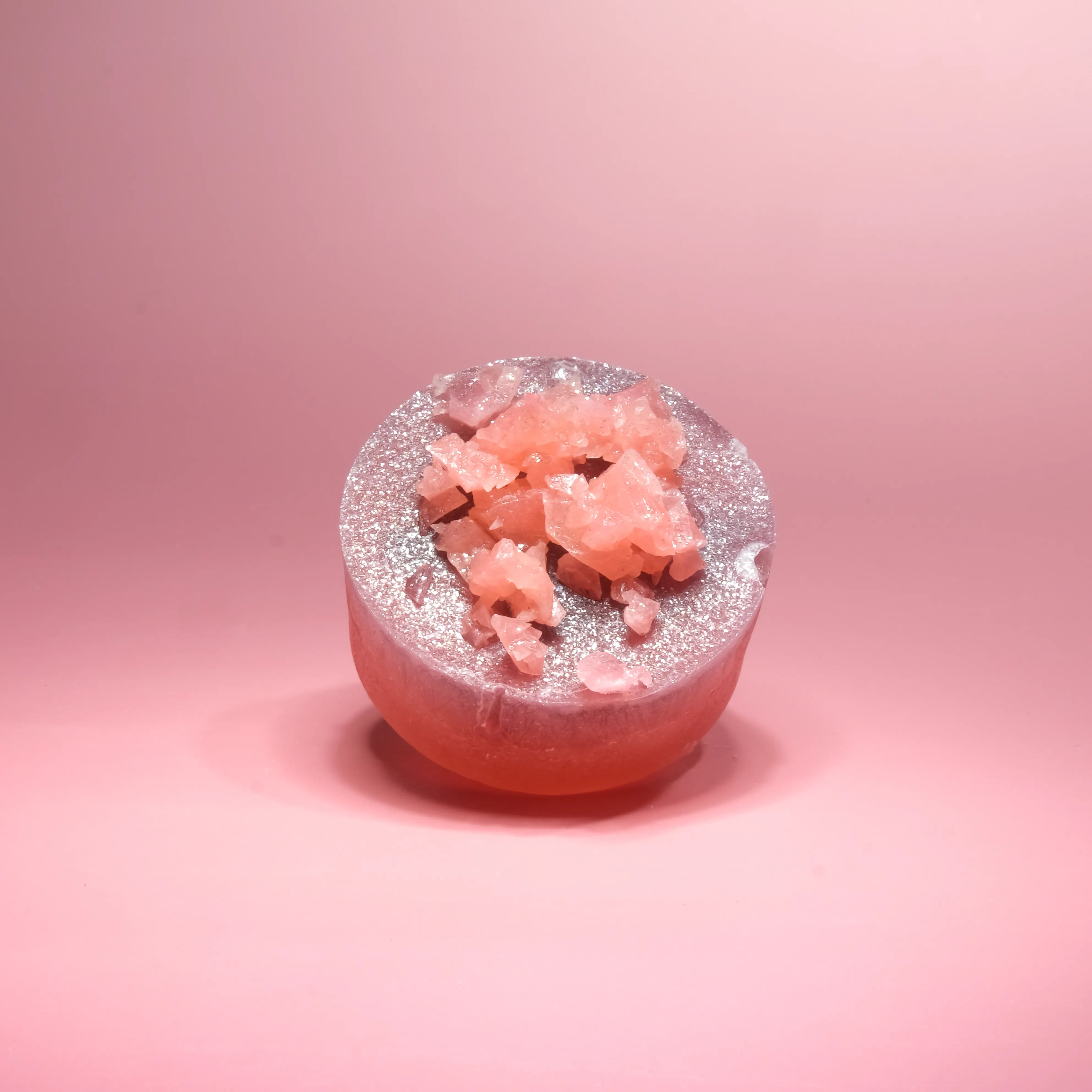 Cranberry pineapple crystal candy with vibrant red tones and a glossy crystal shell, topped with crushed candy crystals.