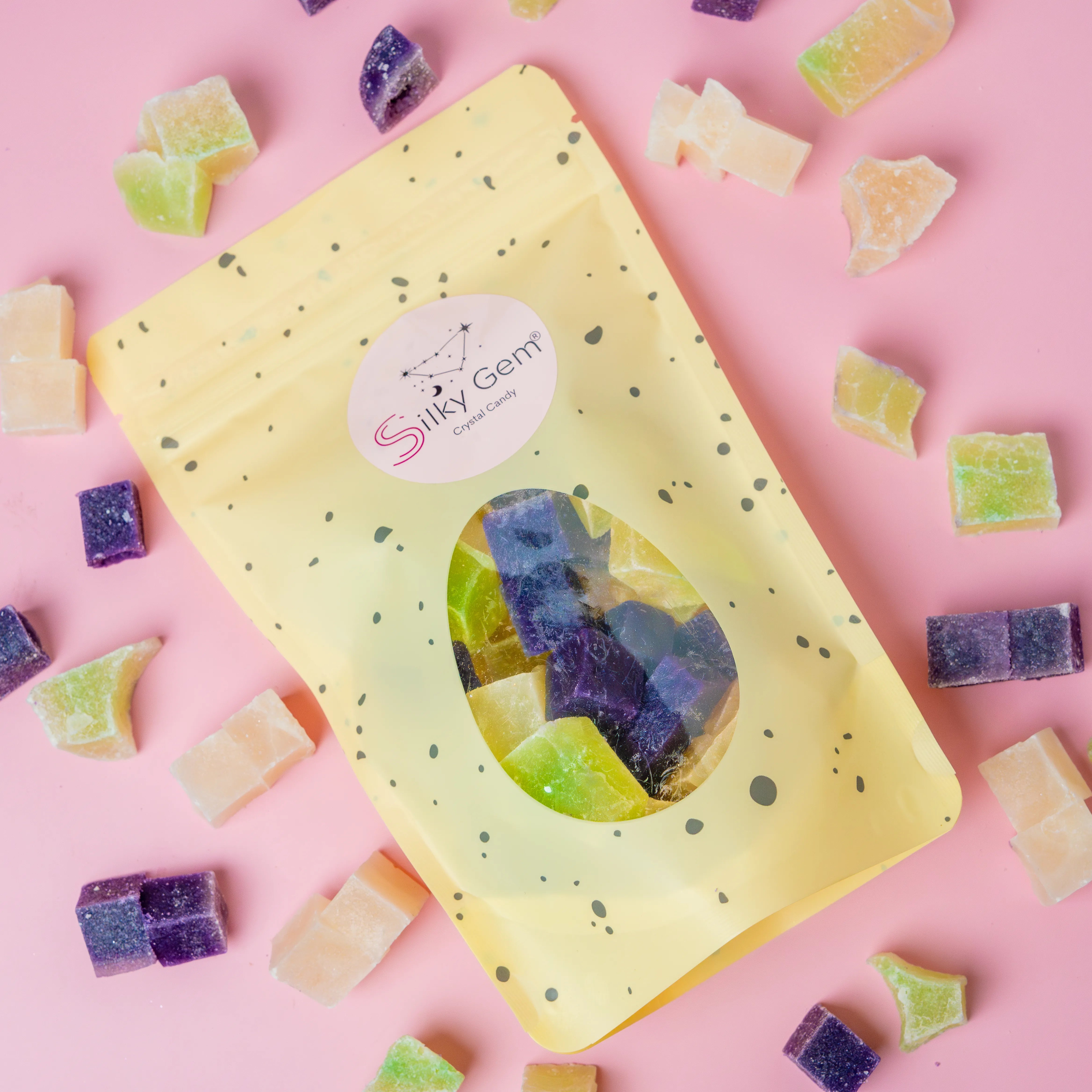 Coconut snack bites pouch with purple, white, and green crystal candy.