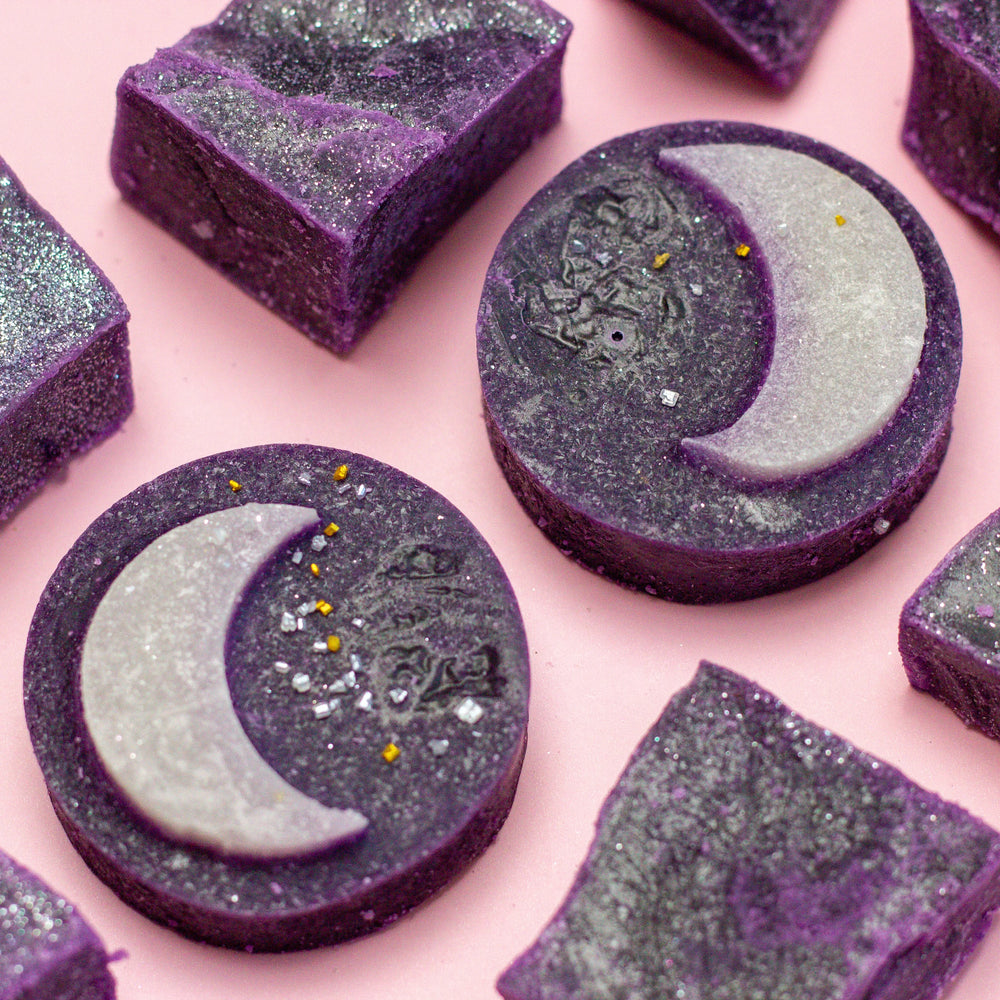 Purple Ube Coconut crystal candies with celestial details on pink background