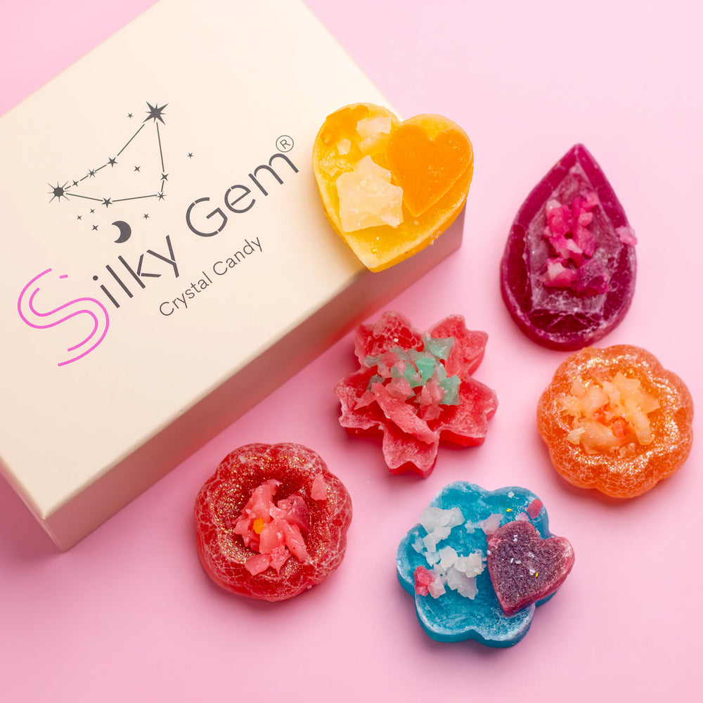 Crystalicious 2.0 six-piece Silky Gem crystal candy collection on pink background