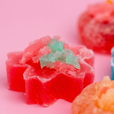 Crystalicious 2.0 fruit-flavored crystal candies on a pink background