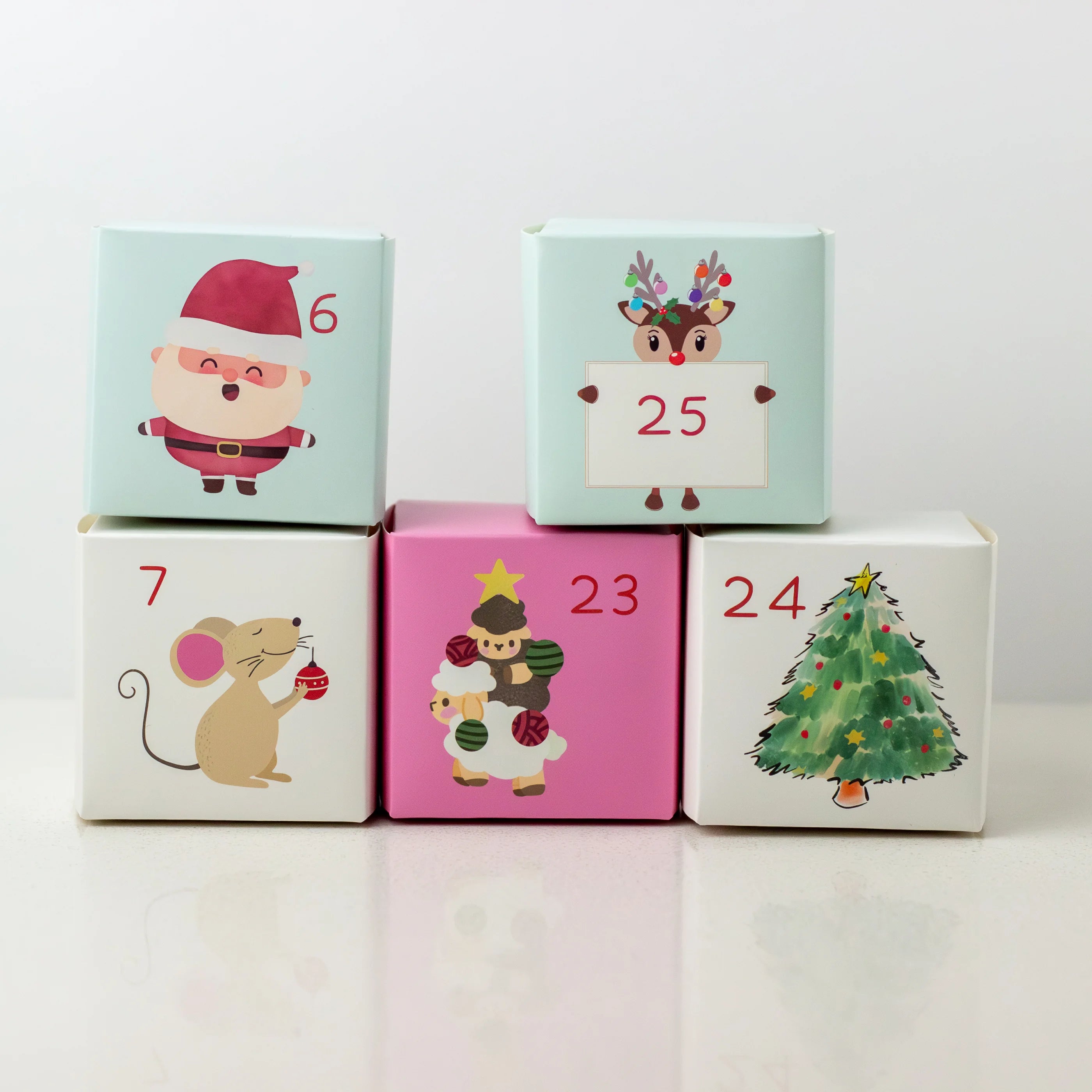 Set of colorful blocks with Christmas-themed illustrations and numbers on a white background