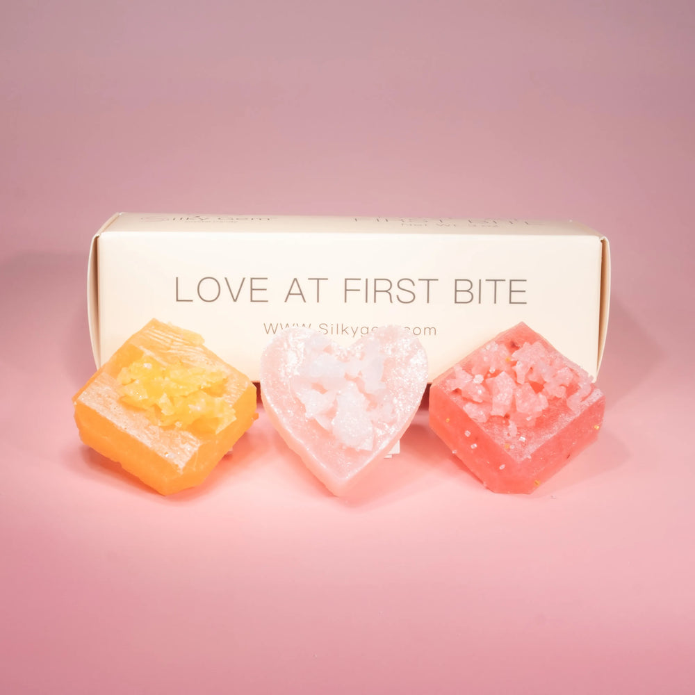 Love at First Bite Trio crystal candies with Silky Gem box on a pink background
