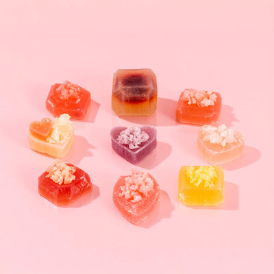 Silky Gem Love at First Bite 9-piece assorted crystal candy collection on a pink background