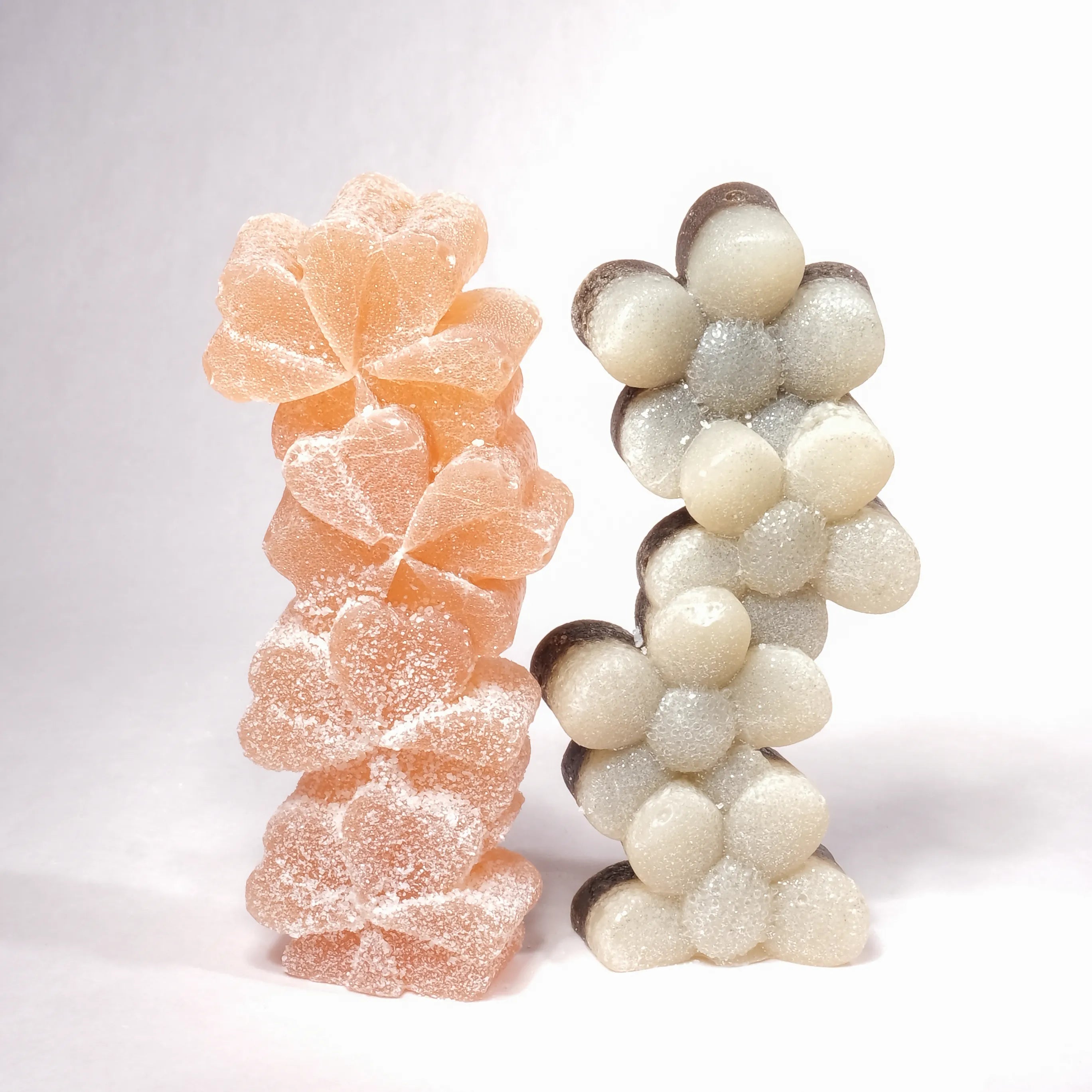 Two decorative items resembling gummy bears on a white background