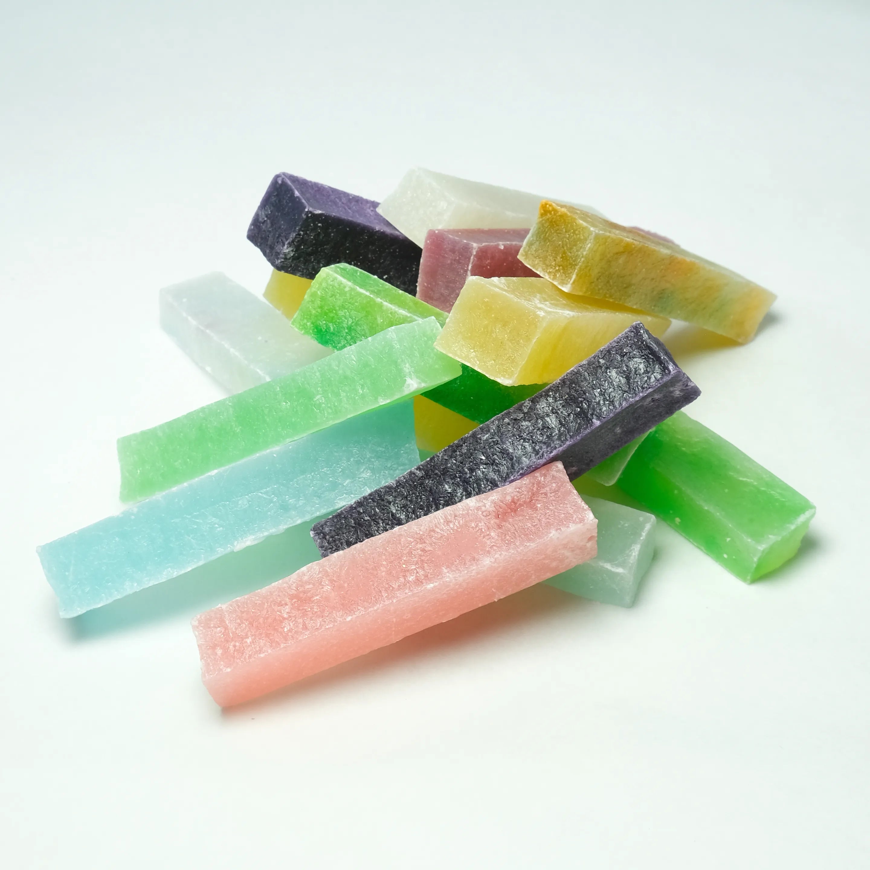 Close-up pile of assorted Silky Gem Lunar Crystals candy bars in soft jewel tones, crafted as crystal candy to be savored during Lunar New Year.