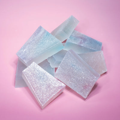 A pile of lychee aurora crystal candy with blue and purple  hue, almost translucent.