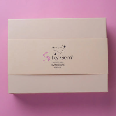 Silky Gem Mystery Box packaging on a pink background