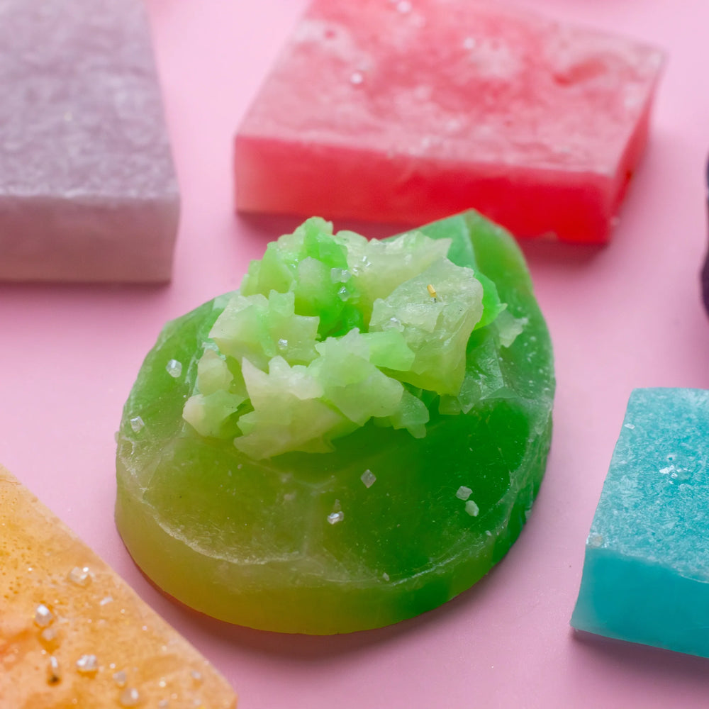 Assorted colorful Silky Gem crystal candies from the Mystery Box on pink background