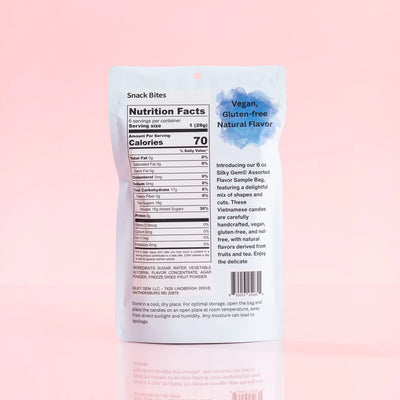 Silky Gem® Sour Bites nutritional facts label, featuring ingredient details and dietary information on a soft pink gradient background.