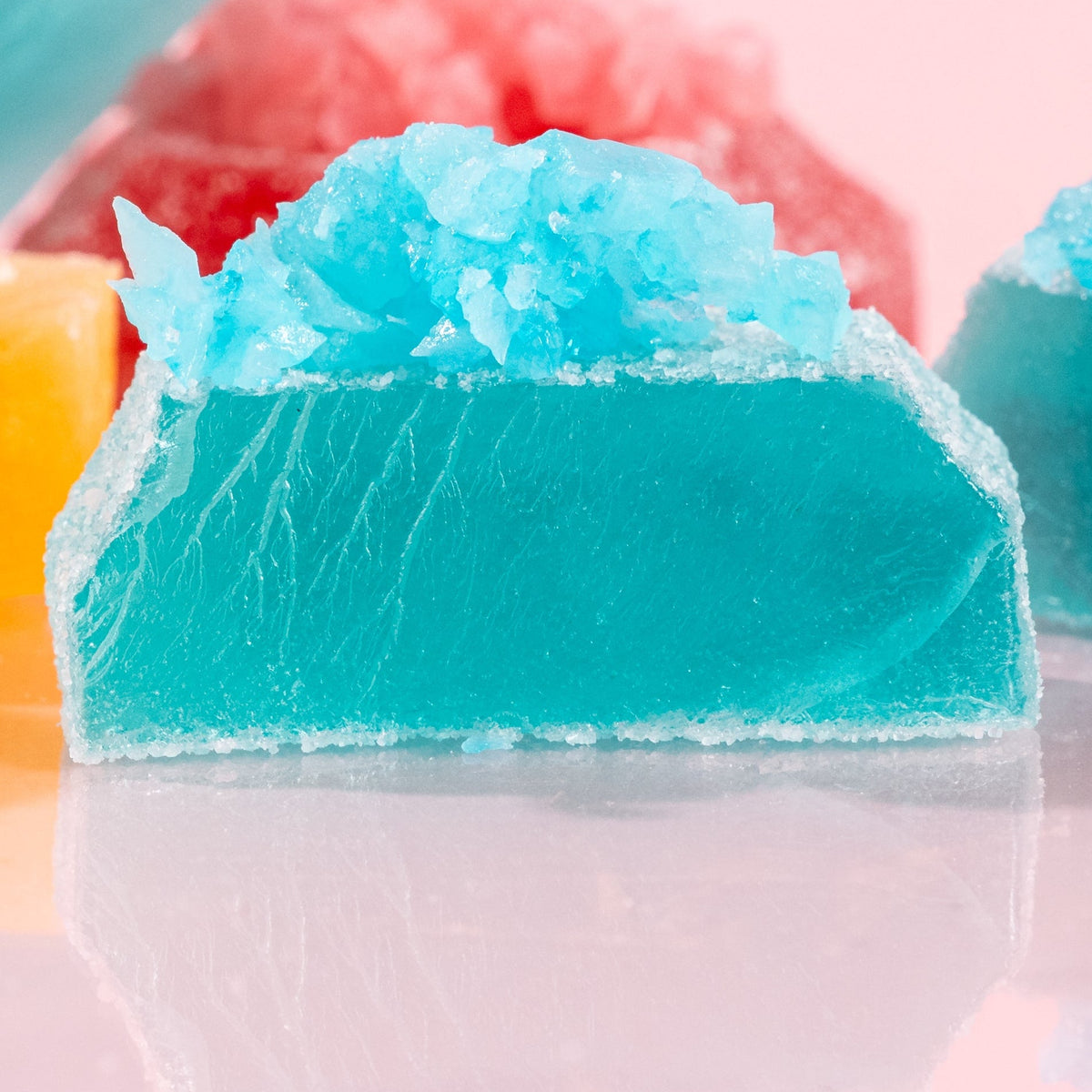 Close-up of cut-open Silky Gem crystal candy pieces from The Golden Lava collection. 